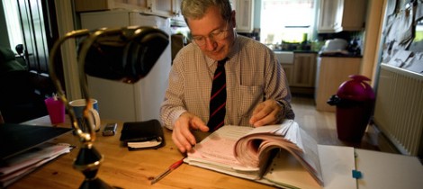 Former maths teacher Paul Buzzard at home working