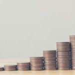 Copper coins stacked up from left to right, rising in height